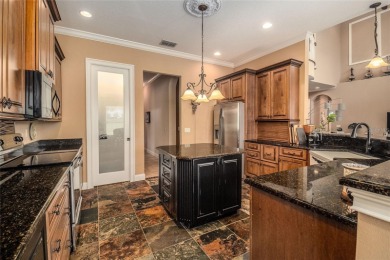 Welcome to your dream home, located on the 9th hole in the on The Club at Eaglebrooke in Florida - for sale on GolfHomes.com, golf home, golf lot