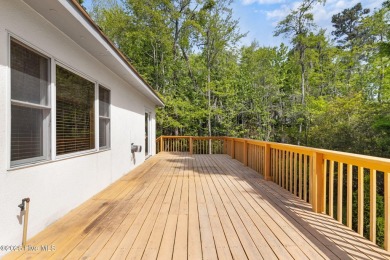 Welcome home to this cozy custom-built ranch nestled in the on Sound Golf Links at Albemarle Plantation in North Carolina - for sale on GolfHomes.com, golf home, golf lot