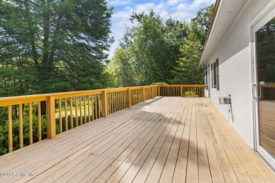 Welcome home to this cozy custom-built ranch nestled in the on Sound Golf Links at Albemarle Plantation in North Carolina - for sale on GolfHomes.com, golf home, golf lot