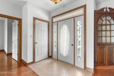 Welcome home to this cozy custom-built ranch nestled in the on Sound Golf Links at Albemarle Plantation in North Carolina - for sale on GolfHomes.com, golf home, golf lot