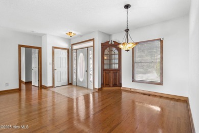 Welcome home to this cozy custom-built ranch nestled in the on Sound Golf Links at Albemarle Plantation in North Carolina - for sale on GolfHomes.com, golf home, golf lot