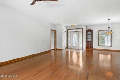 Welcome home to this cozy custom-built ranch nestled in the on Sound Golf Links at Albemarle Plantation in North Carolina - for sale on GolfHomes.com, golf home, golf lot
