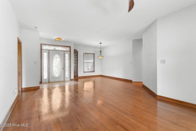 Welcome home to this cozy custom-built ranch nestled in the on Sound Golf Links at Albemarle Plantation in North Carolina - for sale on GolfHomes.com, golf home, golf lot