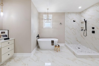 Discover luxury living and unmatched flexibility in this on Bay Point Resort Golf Club in Florida - for sale on GolfHomes.com, golf home, golf lot