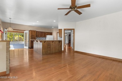 Welcome home to this cozy custom-built ranch nestled in the on Sound Golf Links at Albemarle Plantation in North Carolina - for sale on GolfHomes.com, golf home, golf lot