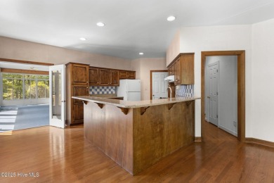 Welcome home to this cozy custom-built ranch nestled in the on Sound Golf Links at Albemarle Plantation in North Carolina - for sale on GolfHomes.com, golf home, golf lot