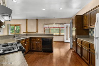 Welcome home to this cozy custom-built ranch nestled in the on Sound Golf Links at Albemarle Plantation in North Carolina - for sale on GolfHomes.com, golf home, golf lot