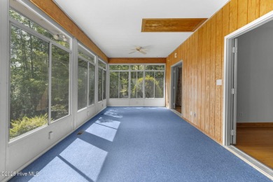 Welcome home to this cozy custom-built ranch nestled in the on Sound Golf Links at Albemarle Plantation in North Carolina - for sale on GolfHomes.com, golf home, golf lot