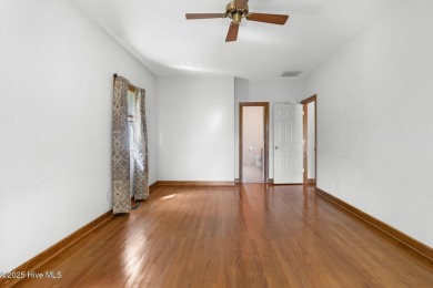 Welcome home to this cozy custom-built ranch nestled in the on Sound Golf Links at Albemarle Plantation in North Carolina - for sale on GolfHomes.com, golf home, golf lot