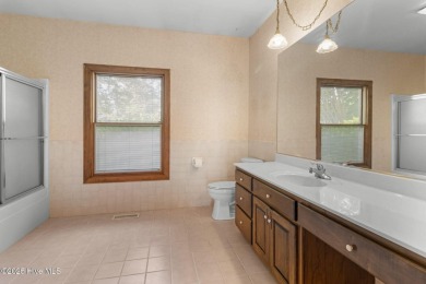 Welcome home to this cozy custom-built ranch nestled in the on Sound Golf Links at Albemarle Plantation in North Carolina - for sale on GolfHomes.com, golf home, golf lot