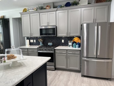 Coastal Sophistication Meets Designer Detail: Experience on LPGA International Golf Course in Florida - for sale on GolfHomes.com, golf home, golf lot