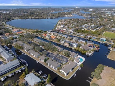 Embrace quintessential Florida waterfront living in this on Tarpon Springs Golf Course in Florida - for sale on GolfHomes.com, golf home, golf lot