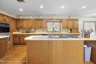 Located in the highly desirable Dogwood Estates golf course on Brooksville Country Club At Majestic Oaks in Florida - for sale on GolfHomes.com, golf home, golf lot
