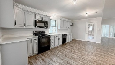 This exceptionally-updated 3 bedroom, 3 bathroom brick home in on Cedar Creek Country Club in Texas - for sale on GolfHomes.com, golf home, golf lot