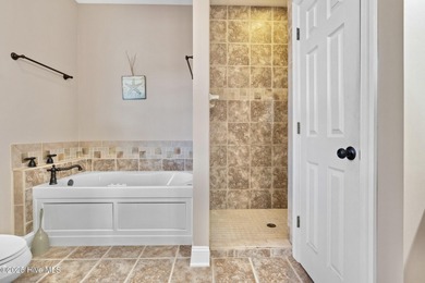 Designed for the best of coastal living! Impressive Sunset Beach on Sea Trail Golf Resort in North Carolina - for sale on GolfHomes.com, golf home, golf lot