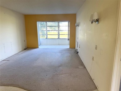 Discover the delightful charm of this distinctive property on Wynmoor Golf Course in Florida - for sale on GolfHomes.com, golf home, golf lot