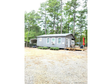 2023 Newly remodeled Camper with addition. This enclosed camper on River Ridge Golf Club in Virginia - for sale on GolfHomes.com, golf home, golf lot