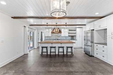Experience the best of Florida living in this stunning two-story on Ocean Palm Golf Course in Florida - for sale on GolfHomes.com, golf home, golf lot