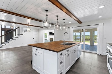 Experience the best of Florida living in this stunning two-story on Ocean Palm Golf Course in Florida - for sale on GolfHomes.com, golf home, golf lot