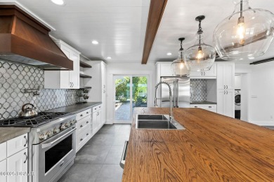 Experience the best of Florida living in this stunning two-story on Ocean Palm Golf Course in Florida - for sale on GolfHomes.com, golf home, golf lot
