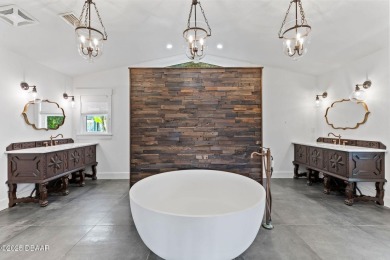 Experience the best of Florida living in this stunning two-story on Ocean Palm Golf Course in Florida - for sale on GolfHomes.com, golf home, golf lot