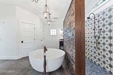Experience the best of Florida living in this stunning two-story on Ocean Palm Golf Course in Florida - for sale on GolfHomes.com, golf home, golf lot