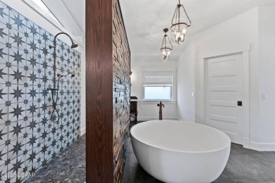 Experience the best of Florida living in this stunning two-story on Ocean Palm Golf Course in Florida - for sale on GolfHomes.com, golf home, golf lot