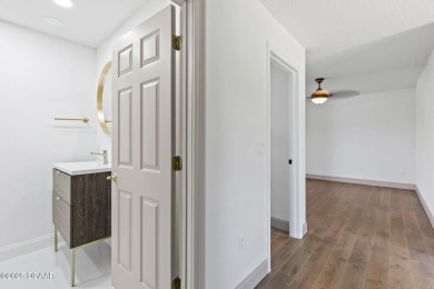 Experience the best of Florida living in this stunning two-story on Ocean Palm Golf Course in Florida - for sale on GolfHomes.com, golf home, golf lot