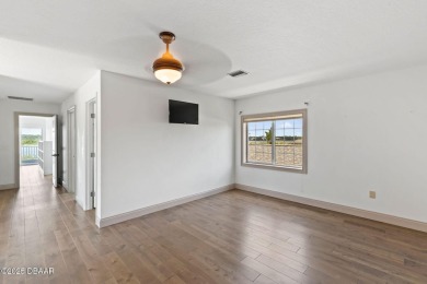 Experience the best of Florida living in this stunning two-story on Ocean Palm Golf Course in Florida - for sale on GolfHomes.com, golf home, golf lot