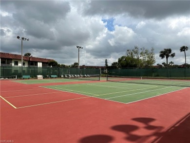 This furnished, turnkey ground-floor condo offers a lake view on Golden Gate Country Club in Florida - for sale on GolfHomes.com, golf home, golf lot