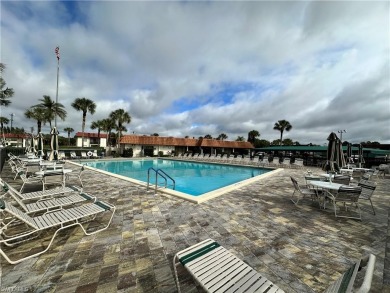 This furnished, turnkey ground-floor condo offers a lake view on Golden Gate Country Club in Florida - for sale on GolfHomes.com, golf home, golf lot