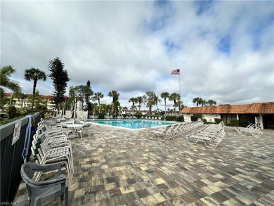 This furnished, turnkey ground-floor condo offers a lake view on Golden Gate Country Club in Florida - for sale on GolfHomes.com, golf home, golf lot