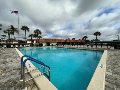 This furnished, turnkey ground-floor condo offers a lake view on Golden Gate Country Club in Florida - for sale on GolfHomes.com, golf home, golf lot