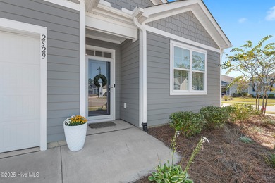 Nestled in the highly sought-after Brunswick Forest community on Cape Fear National At Brunswick Forest in North Carolina - for sale on GolfHomes.com, golf home, golf lot