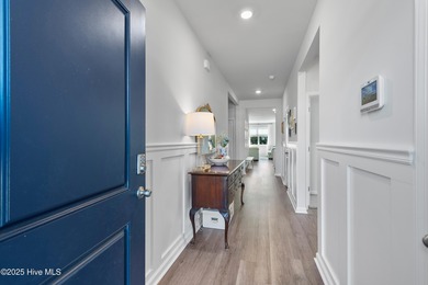 Nestled in the highly sought-after Brunswick Forest community on Cape Fear National At Brunswick Forest in North Carolina - for sale on GolfHomes.com, golf home, golf lot