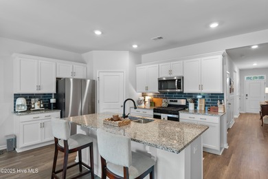 Nestled in the highly sought-after Brunswick Forest community on Cape Fear National At Brunswick Forest in North Carolina - for sale on GolfHomes.com, golf home, golf lot