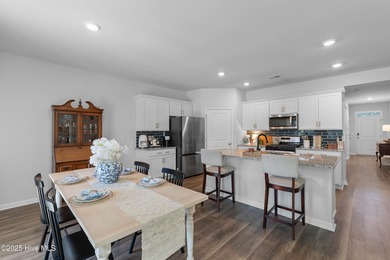 Nestled in the highly sought-after Brunswick Forest community on Cape Fear National At Brunswick Forest in North Carolina - for sale on GolfHomes.com, golf home, golf lot