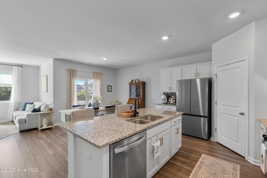 Nestled in the highly sought-after Brunswick Forest community on Cape Fear National At Brunswick Forest in North Carolina - for sale on GolfHomes.com, golf home, golf lot