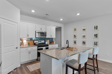 Nestled in the highly sought-after Brunswick Forest community on Cape Fear National At Brunswick Forest in North Carolina - for sale on GolfHomes.com, golf home, golf lot