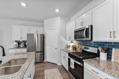 Nestled in the highly sought-after Brunswick Forest community on Cape Fear National At Brunswick Forest in North Carolina - for sale on GolfHomes.com, golf home, golf lot