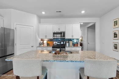 Nestled in the highly sought-after Brunswick Forest community on Cape Fear National At Brunswick Forest in North Carolina - for sale on GolfHomes.com, golf home, golf lot