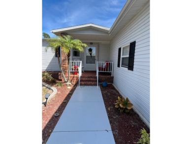 Welcome to this beautifully maintained two-bedroom, two-bath on Pine Lakes Country Club in Florida - for sale on GolfHomes.com, golf home, golf lot