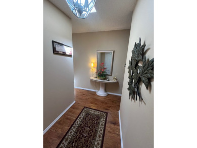 Welcome to this beautifully maintained two-bedroom, two-bath on Pine Lakes Country Club in Florida - for sale on GolfHomes.com, golf home, golf lot