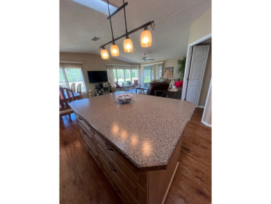 Welcome to this beautifully maintained two-bedroom, two-bath on Pine Lakes Country Club in Florida - for sale on GolfHomes.com, golf home, golf lot