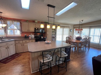 Welcome to this beautifully maintained two-bedroom, two-bath on Pine Lakes Country Club in Florida - for sale on GolfHomes.com, golf home, golf lot