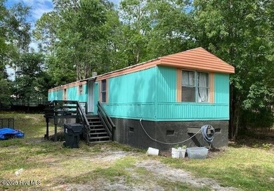Investor opportunity! This 3-bedroom, 1.5-bath manufactured home on The Lakes Country Club in North Carolina - for sale on GolfHomes.com, golf home, golf lot