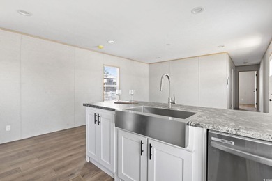 2025 NEW HOME located in the coastal getaway in 55+ Waterway on Barefoot Resort and Golf Club  in South Carolina - for sale on GolfHomes.com, golf home, golf lot