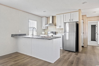 2025 NEW HOME located in the coastal getaway in 55+ Waterway on Barefoot Resort and Golf Club  in South Carolina - for sale on GolfHomes.com, golf home, golf lot