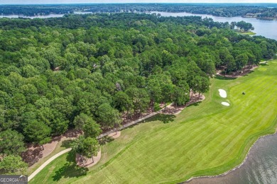 Located in the prestigious Great Waters neighborhood of Reynolds on Great Waters Course At Reynolds Plantation in Georgia - for sale on GolfHomes.com, golf home, golf lot