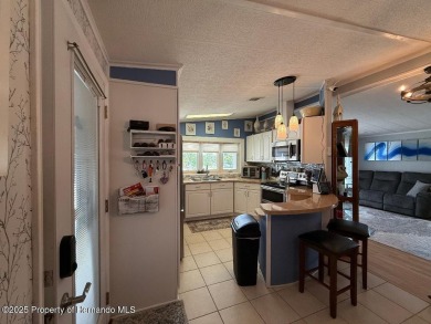 Spacious and well-appointed, this move-in ready two-bedroom on High Point Golf Club, Inc. in Florida - for sale on GolfHomes.com, golf home, golf lot